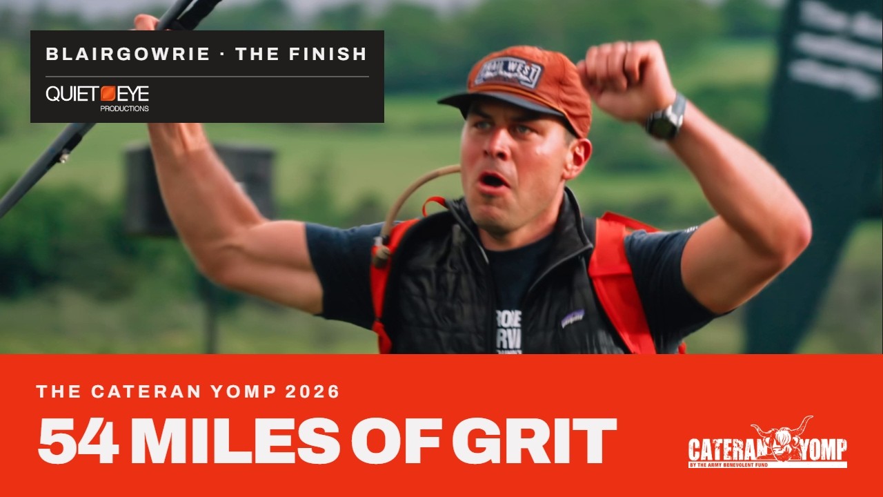 The film's title card. A walker at the finish in Blairgowrie pulls off a cap, mouth open, and the caption reads The Cateran Yomp 2026, 54 Miles of Grit.